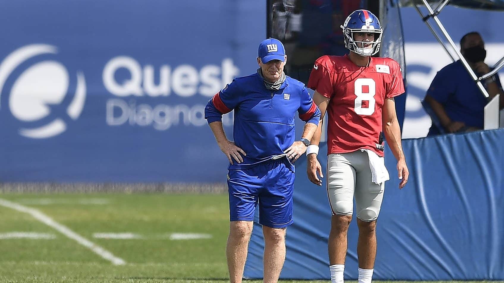 EAST RUTHERFORD, NEW JERSEY - AUGUST 21: Offensive coordinator Jason Garrett looks on with Daniel Jones #8 of the New York Giants during training camp at NY Giants Quest Diagnostics Training Center on August 21, 2020 in East Rutherford, New Jersey.