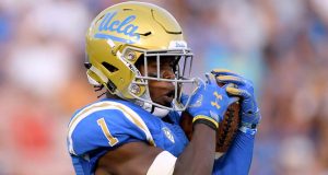 PASADENA, CA - SEPTEMBER 01: Darnay Holmes #1 of the UCLA Bruins catches a punt during a 26-17 loss to the Cincinnati Bearcats at Rose Bowl on September 1, 2018 in Pasadena, California.