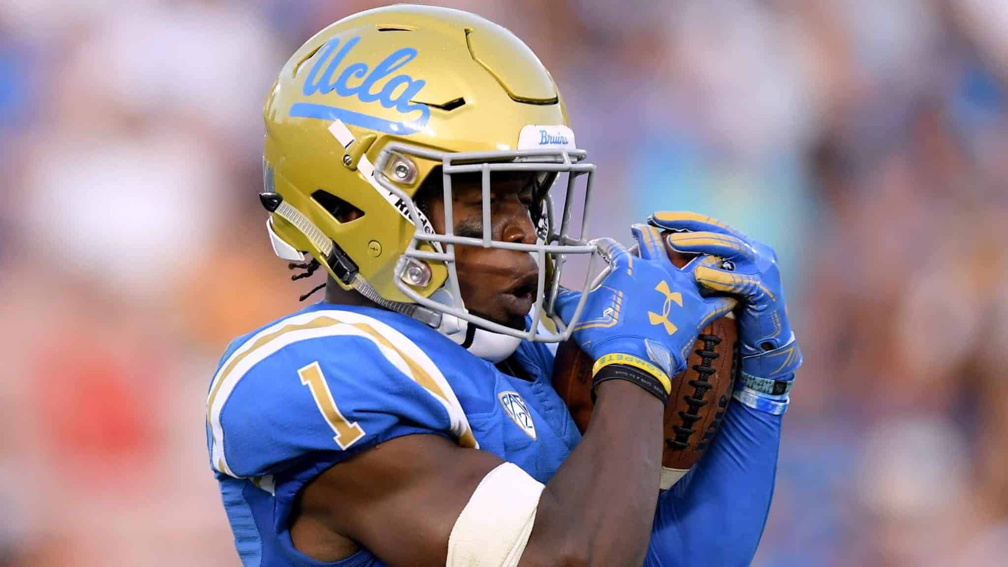 PASADENA, CA - SEPTEMBER 01: Darnay Holmes #1 of the UCLA Bruins catches a punt during a 26-17 loss to the Cincinnati Bearcats at Rose Bowl on September 1, 2018 in Pasadena, California.