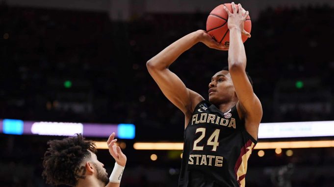 ANAHEIM, CALIFORNIA - MARCH 28: Devin Vassell #24 of the Florida State Seminoles shoots the ball against Josh Perkins #13 of the Gonzaga Bulldogs during the 2019 NCAA Men's Basketball Tournament West Regional at Honda Center on March 28, 2019 in Anaheim, California.