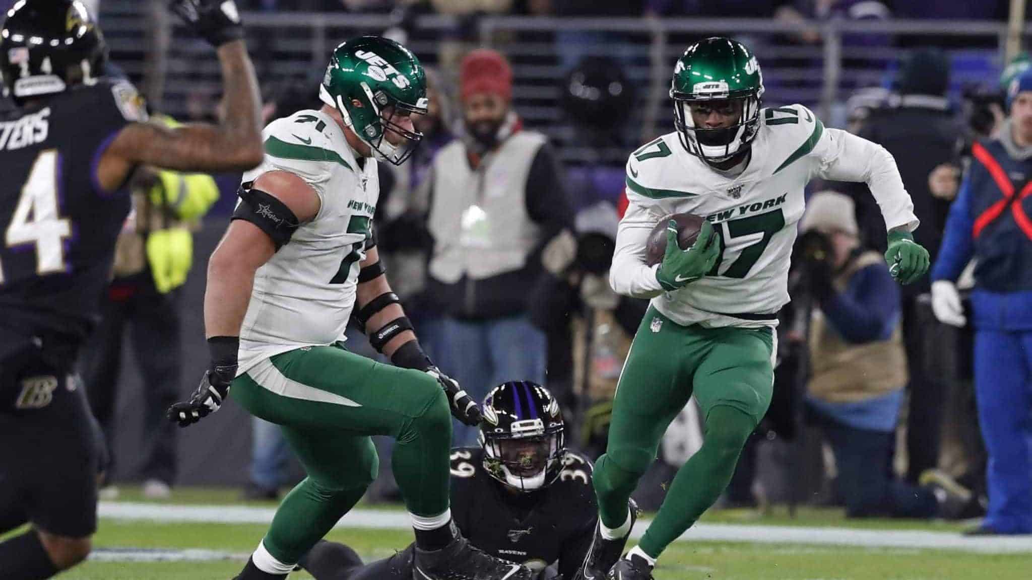 BALTIMORE, MARYLAND - DECEMBER 12: Wide Receiver Vyncint Smith #17 of the New York Jets runs with the ball during the second quarter against the Baltimore Ravens at M&T Bank Stadium on December 12, 2019 in Baltimore, Maryland.