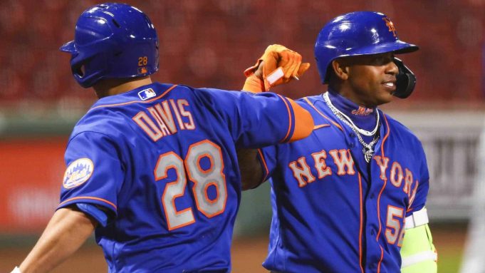 BOSTON, MA - JULY 28: J.D. Davis #28 and Yoenis Cespedes #52 of the New York Mets after Davis' two-run home run in the fifth inning against the Boston Red Sox at Fenway Park on July 28, 2020 in Boston, Massachusetts.