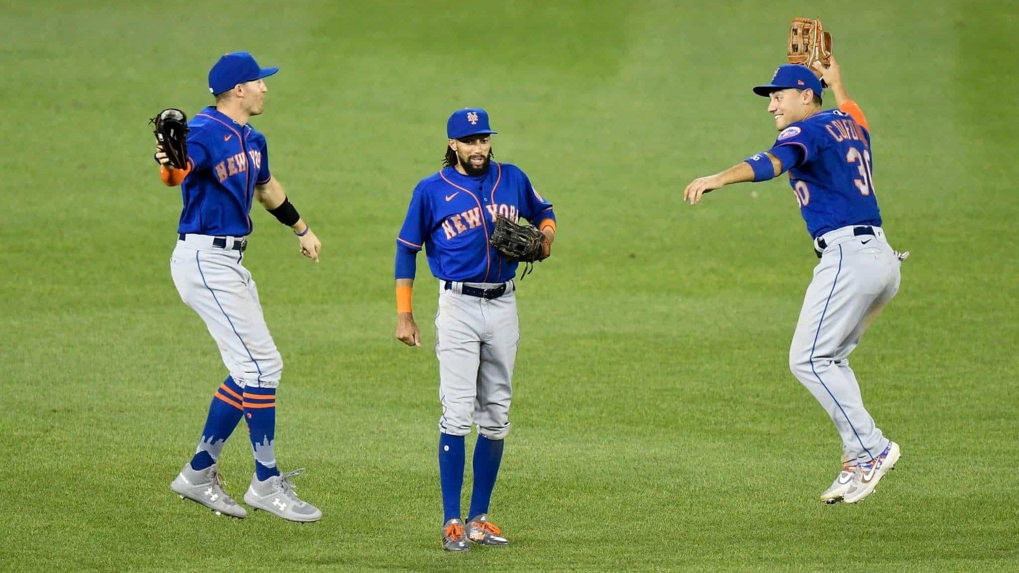 WASHINGTON, DC - AUGUST 05: Brandon Nimmo #9, Billy Hamilton #21 and Michael Conforto #30 of the New York Mets celebrate a 3-1 victory over the Washington Nationals at Nationals Park on August 5, 2020 in Washington, DC.