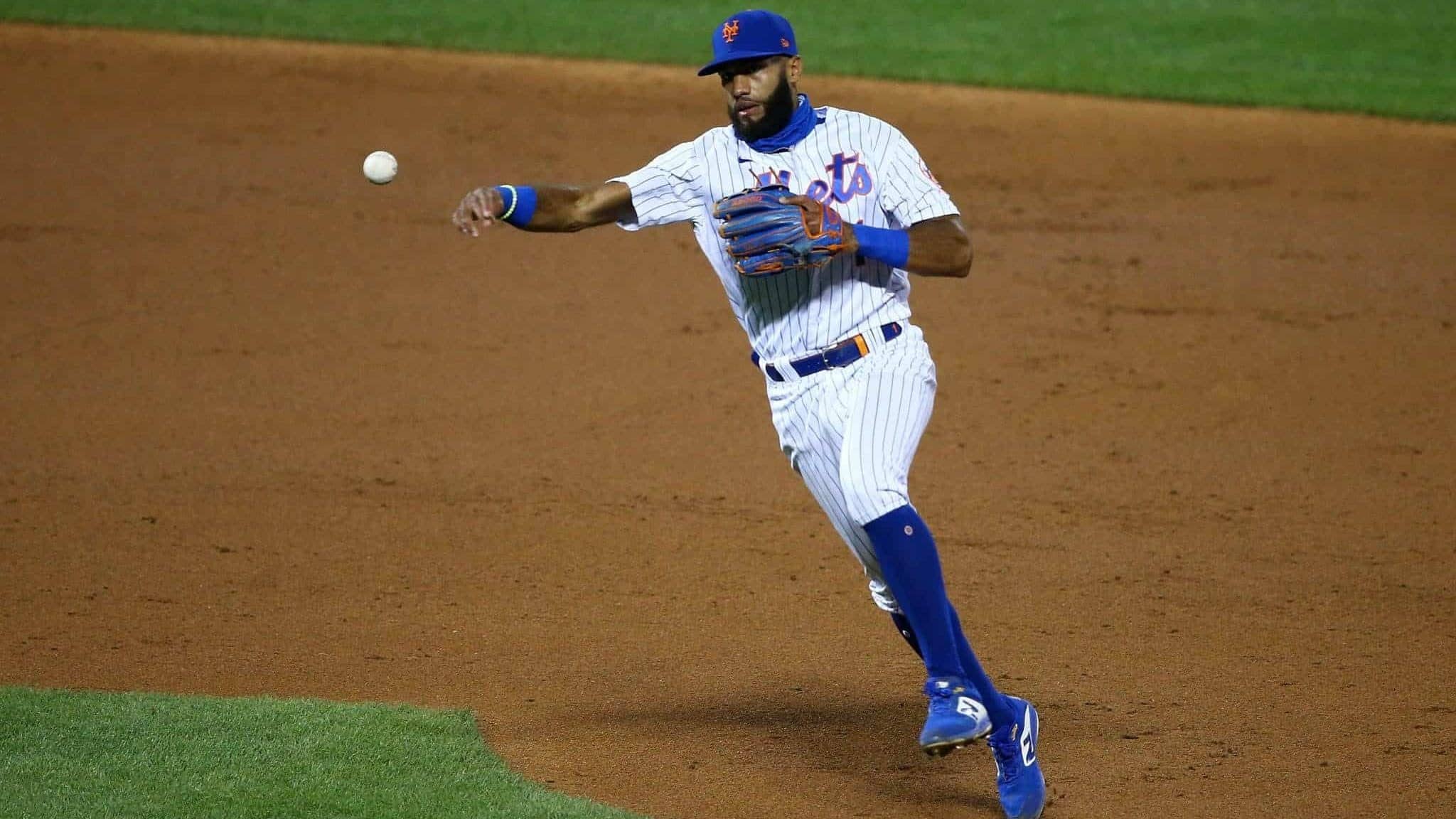 NEW YORK, NEW YORK - AUGUST 25: Amed Rosario #1 of the New York Mets field a ground ball off the bat of Jonathan Villar #2 of the Miami Marlins for an out in the second inning at Citi Field on August 25, 2020 in New York City.