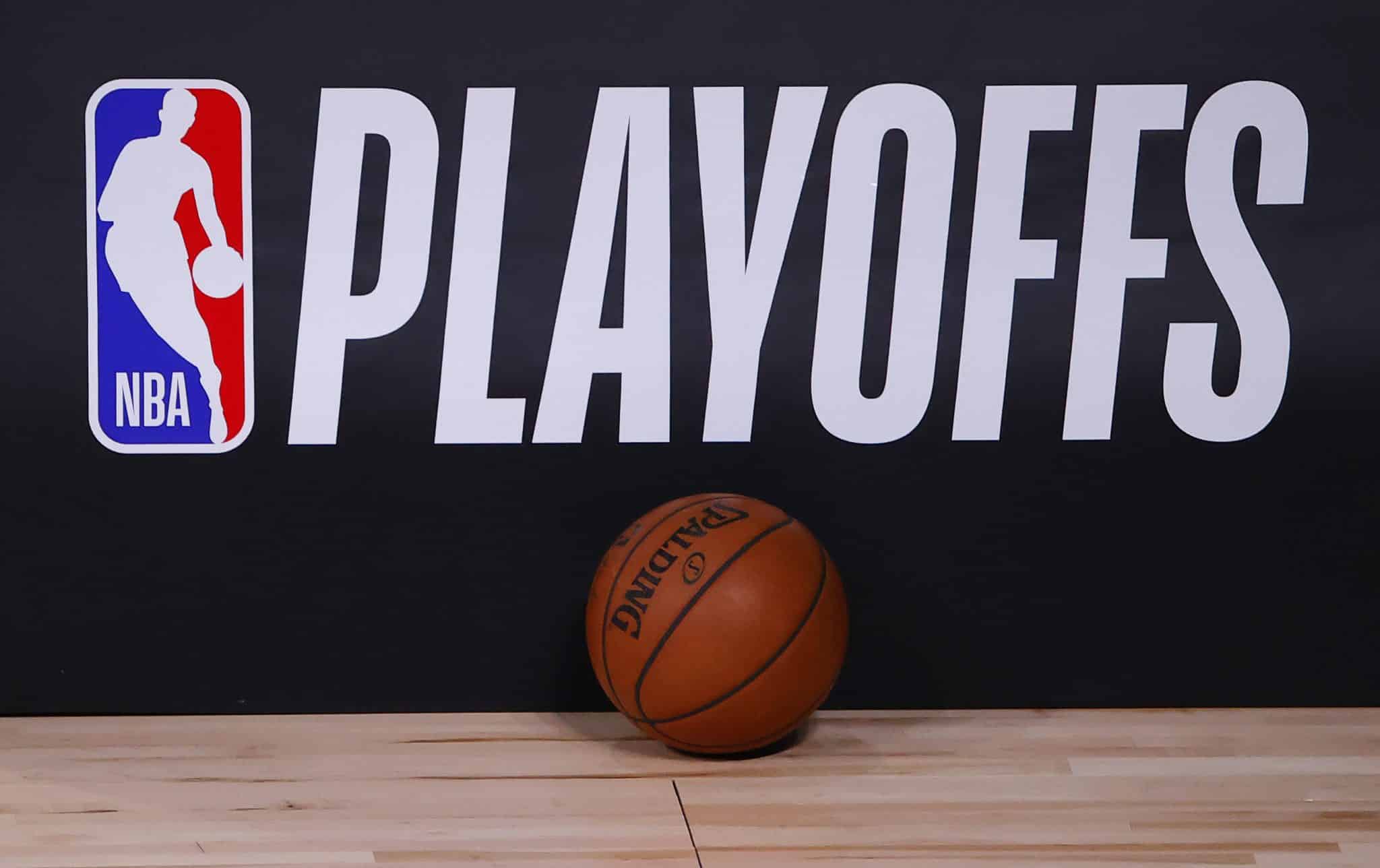 LAKE BUENA VISTA, FLORIDA - AUGUST 26: A basketball sits next to an NBA Playoffs logo in Game Five of the Eastern Conference First Round scheduled between the Milwaukee Bucks and the Orlando Magic during the 2020 NBA Playoffs at AdventHealth Arena at ESPN Wide World Of Sports Complex on August 26, 2020 in Lake Buena Vista, Florida. NOTE TO USER: User expressly acknowledges and agrees that, by downloading and or using this photograph, User is consenting to the terms and conditions of the Getty Images License Agreement.
