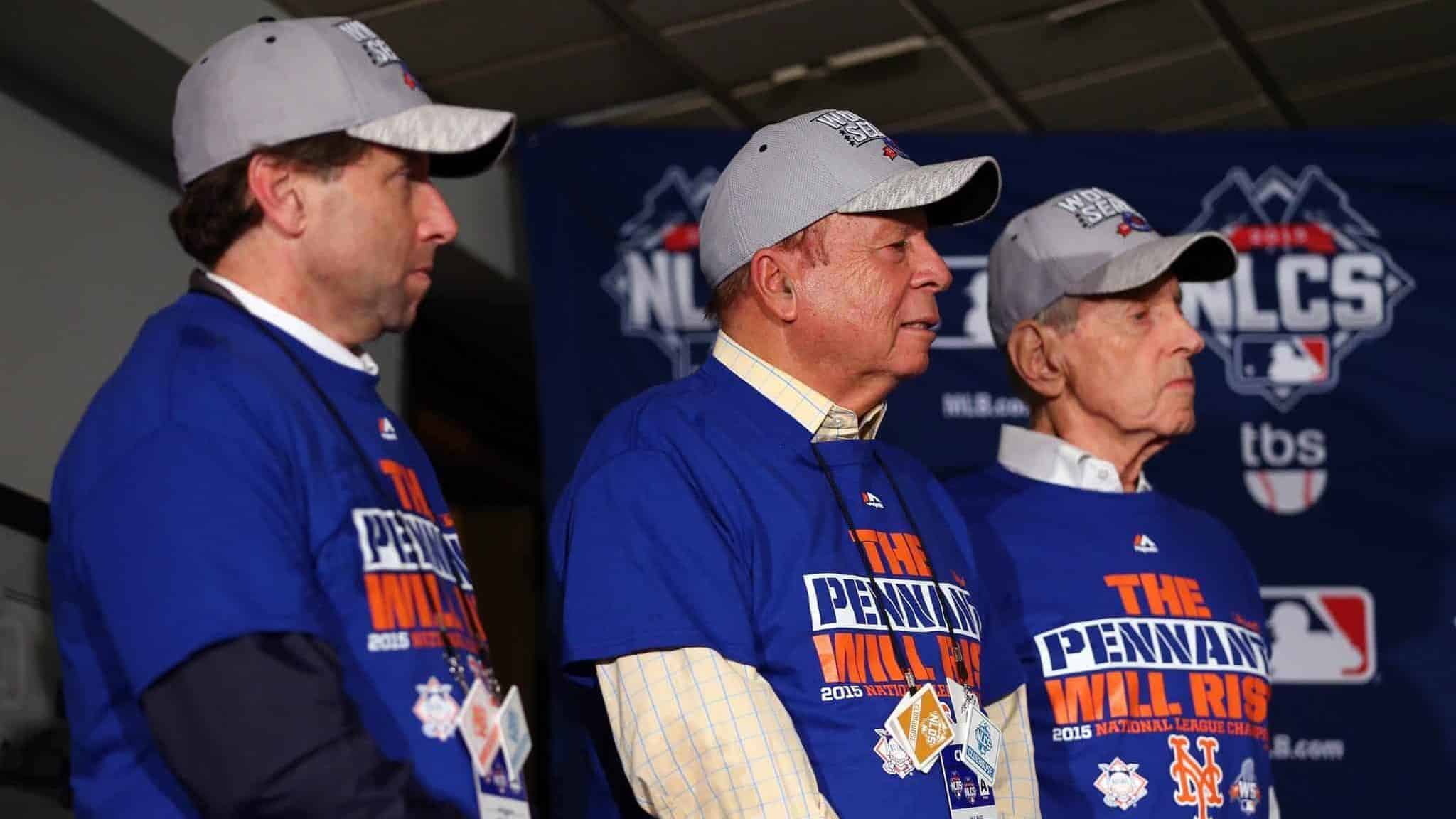 CHICAGO, IL - OCTOBER 21: (L-R) Chief Operating Officer Jeff Wilpon, Chief Executive Officer Saul Katz and Owner Fred Wilpon of the New York Mets look on after defeating the Chicago Cubs in game four of the 2015 MLB National League Championship Series at Wrigley Field on October 21, 2015 in Chicago, Illinois. The Mets defeated the Cubs with a score of 8 to 3 to sweep the Championship Series.
