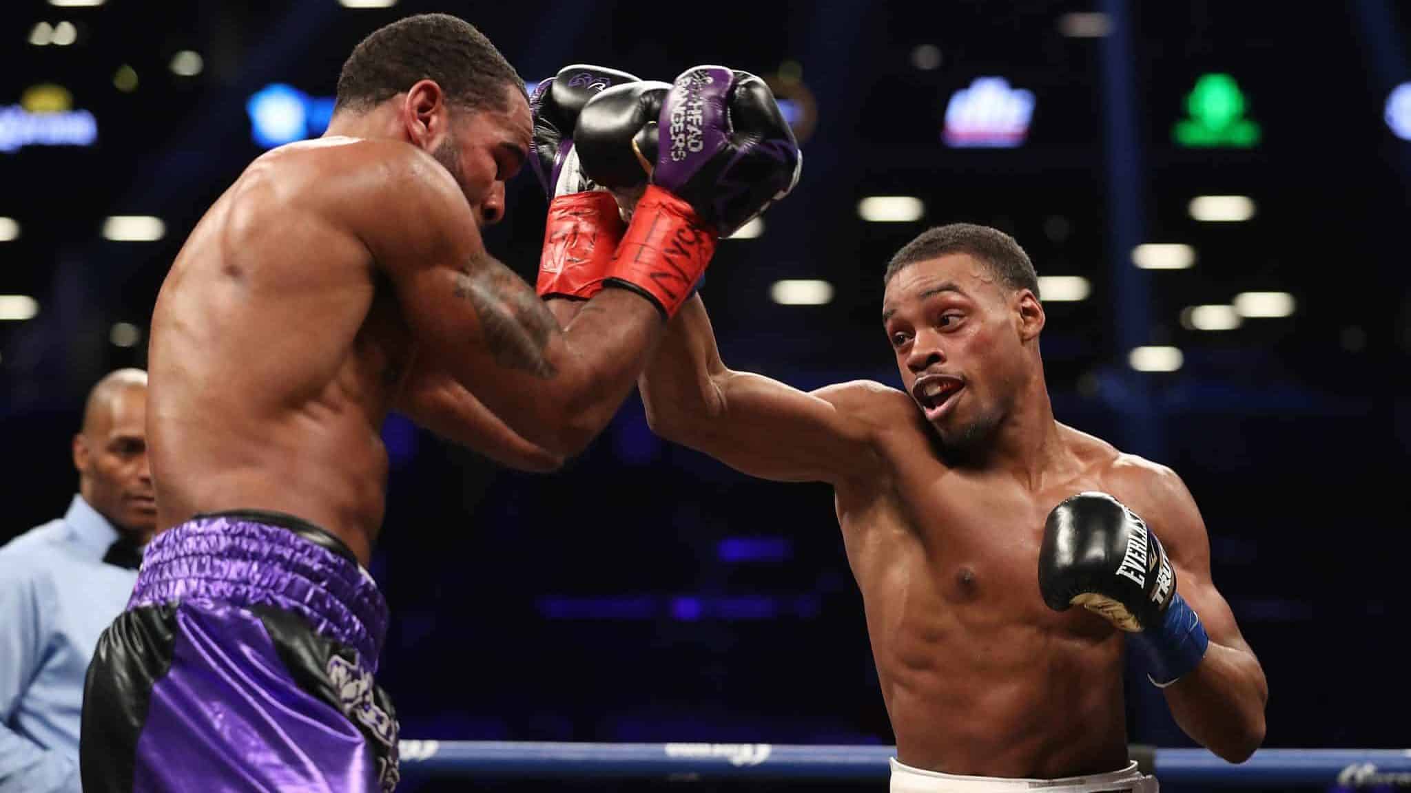NEW YORK, NY - JANUARY 20: Errol Spence punches Lamont Peterson during their IBF Welterweight title fight at the Barclays Center on January 20, 2018 in New York City.