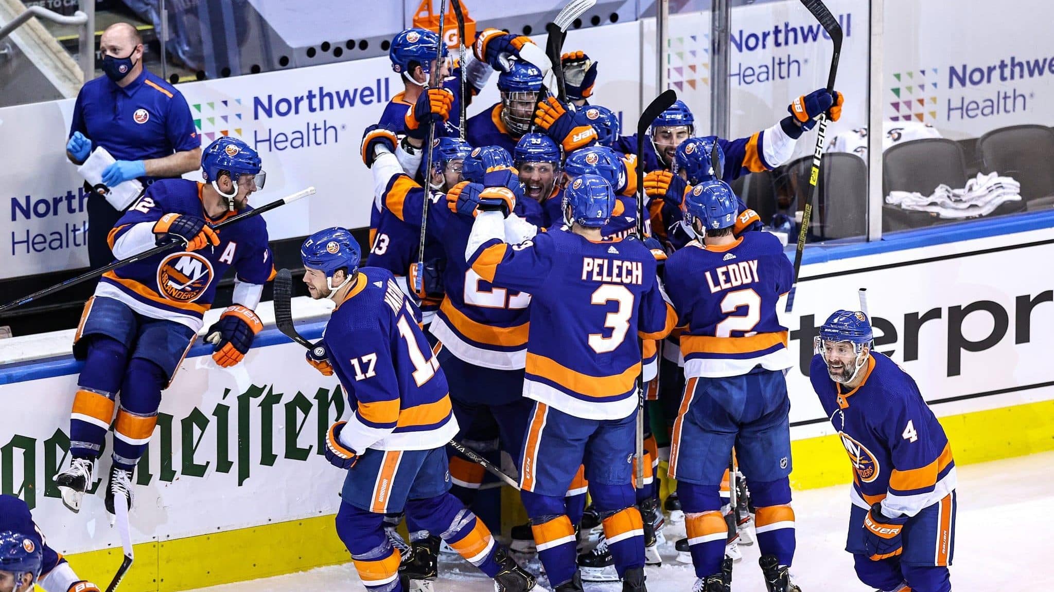 TORONTO, ONTARIO - AUGUST 16: The New York Islanders celebrate the game winning goal by Mathew Barzal #13 against the Washington Capitals during the first overtime period for a 2-1 win in Game Three of the Eastern Conference First Round during the 2020 NHL Stanley Cup Playoffs at Scotiabank Arena on August 16, 2020 in Toronto, Ontario.