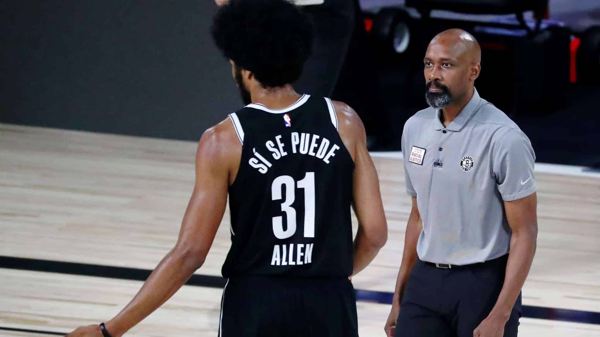 LAKE BUENA VISTA, FLORIDA - AUGUST 21: Head coach Jacque Vaughn of the Brooklyn Nets talks with Jarrett Allen #31 during a break in play against the Toronto Raptors during the second half in game three of the first round of the 2020 NBA Playoffs at The Field House at ESPN Wide World Of Sports Complex on August 21, 2020 in Lake Buena Vista, Florida. NOTE TO USER: User expressly acknowledges and agrees that, by downloading and or using this photograph, User is consenting to the terms and conditions of the Getty Images License Agreement. (