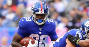 EAST RUTHERFORD, NEW JERSEY - OCTOBER 06: Jon Hilliman #28 of the New York Giants carries the ball during the fourth quarter of their game against the Minnesota Vikings at MetLife Stadium on October 06, 2019 in East Rutherford, New Jersey.