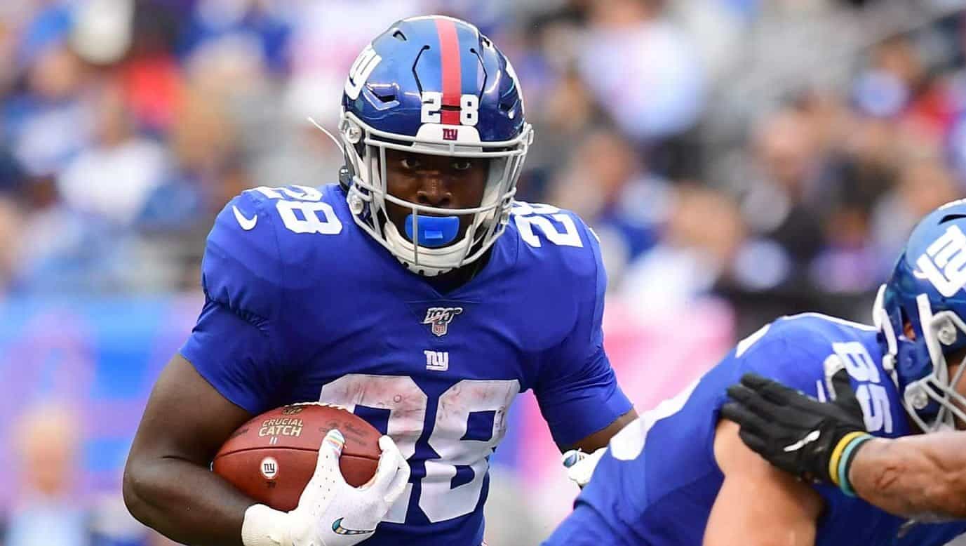 EAST RUTHERFORD, NEW JERSEY - OCTOBER 06: Jon Hilliman #28 of the New York Giants carries the ball during the fourth quarter of their game against the Minnesota Vikings at MetLife Stadium on October 06, 2019 in East Rutherford, New Jersey.