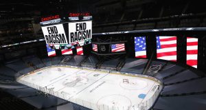 EDMONTON, ALBERTA - AUGUST 26: "End Racism" is displayed on the scoreboard in light of the recent events in Kenosha, Wisconsin, in regards to the shooting of Jacob Blake, prior to Game Three of the Western Conference Second Round during the 2020 NHL Stanley Cup Playoffs at Rogers Place on August 26, 2020 in Edmonton, Alberta.