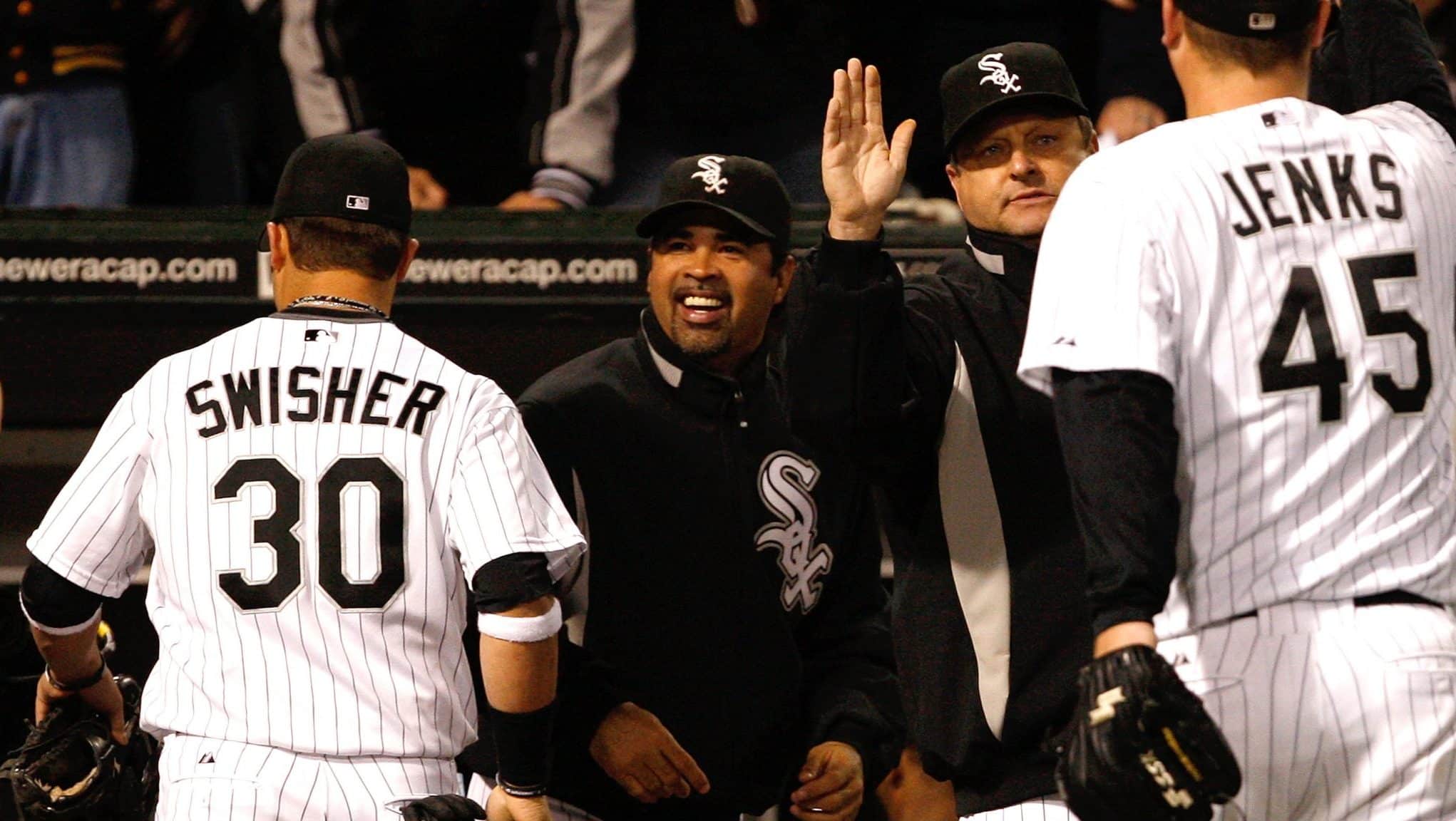 CHICAGO - OCTOBER 05: Manager Ozzie Guillen #13 of the Chicago White Sox celebrates their 5-3 win against the Tampa Bay Rays in Game Three of the ALDS during the 2008 MLB Playoffs at U.S. Cellular Field on October 5, 2008 in Chicago, Illinois.