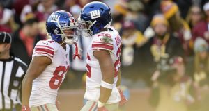 LANDOVER, MD - DECEMBER 22: Saquon Barkley #26 of the New York Giants celebrates with teammate Sterling Shepard #87 after scoring a touchdown in the first half against the Washington Redskins at FedExField on December 22, 2019 in Landover, Maryland.