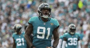 JACKSONVILLE, FL - SEPTEMBER 16: Yannick Ngakoue #91 of the Jacksonville Jaguars celebrates a play in the first half against the New England Patriots at TIAA Bank Field on September 16, 2018 in Jacksonville, Florida.