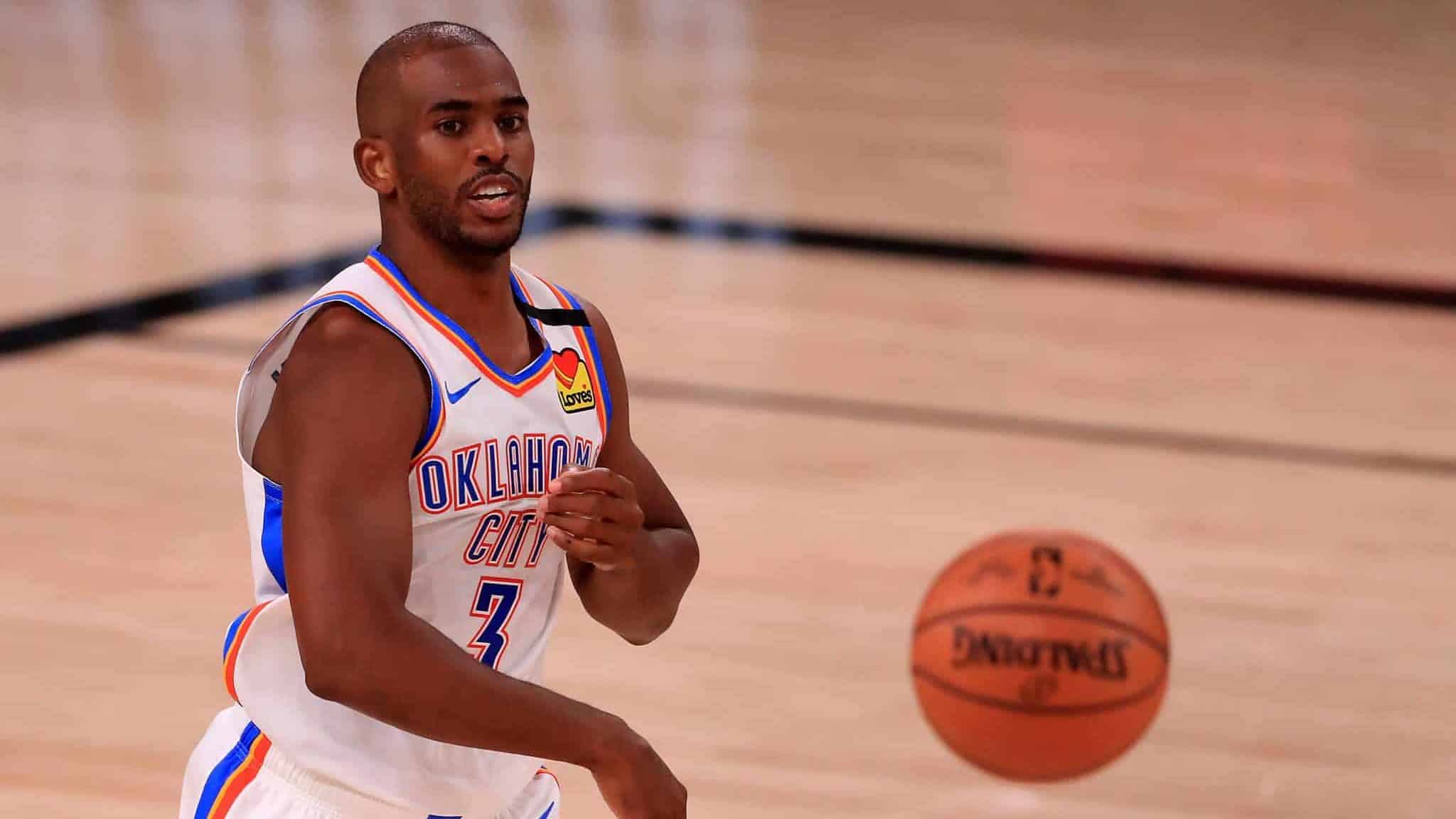 LAKE BUENA VISTA, FLORIDA - SEPTEMBER 02: Chris Paul #3 of the Oklahoma City Thunder passes the ball during the second quarter against the Houston Rockets in Game Seven of the Western Conference First Round during the 2020 NBA Playoffs at AdventHealth Arena at ESPN Wide World Of Sports Complex on September 02, 2020 in Lake Buena Vista, Florida. NOTE TO USER: User expressly acknowledges and agrees that, by downloading and or using this photograph, User is consenting to the terms and conditions of the Getty Images License Agreement.