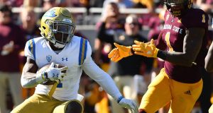 TEMPE, AZ - NOVEMBER 10: Defensive back Darnay Holmes #1 of the UCLA Bruins makes an interception and runs the football 31 yards for a touchdown in the first half against the Arizona State Sun Devils at Sun Devil Stadium on November 10, 2018 in Tempe, Arizona.