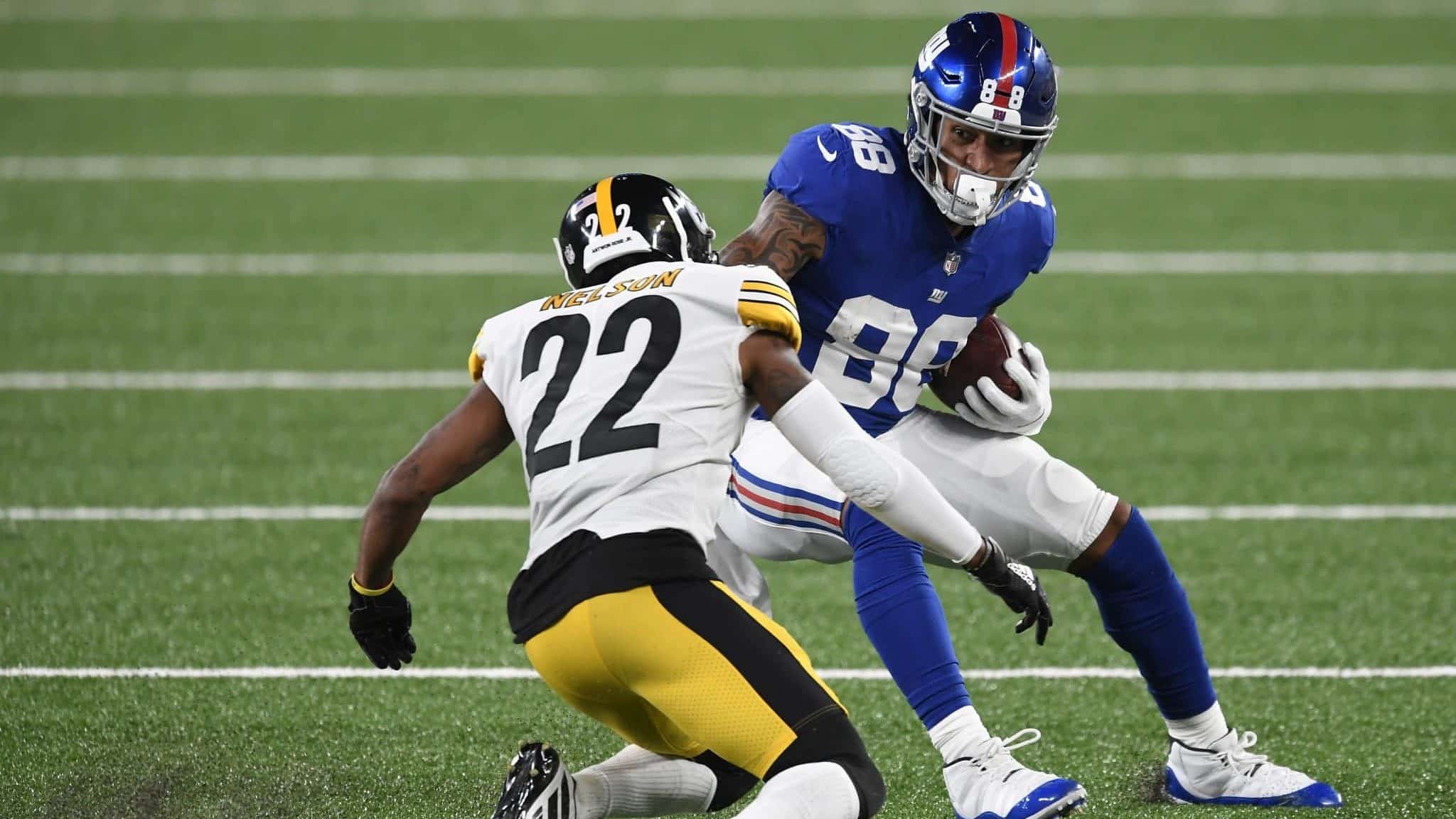 EAST RUTHERFORD, NEW JERSEY - SEPTEMBER 14: Evan Engram #88 of the New York Giants carries the ball as Steven Nelson #22 of the Pittsburgh Steelers defends during the second half at MetLife Stadium on September 14, 2020 in East Rutherford, New Jersey.