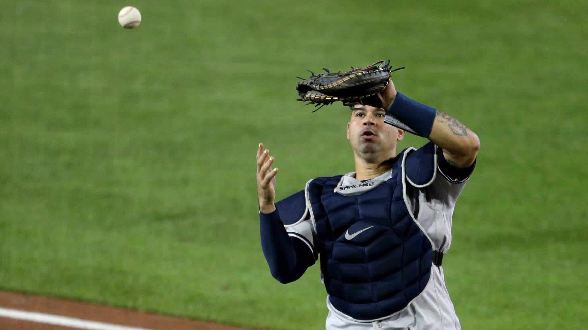 BUFFALO, NEW YORK - SEPTEMBER 08: Gary Sanchez #24 of the New York Yankees reacts while dropping a foul ball hit by Cavan Biggio #8 of the Toronto Blue Jays during the fifth inning at Sahlen Field on September 08, 2020 in Buffalo, New York. The Blue Jays are the home team and are playing their home games in Buffalo due to the Canadian government’s policy on coronavirus (COVID-19).