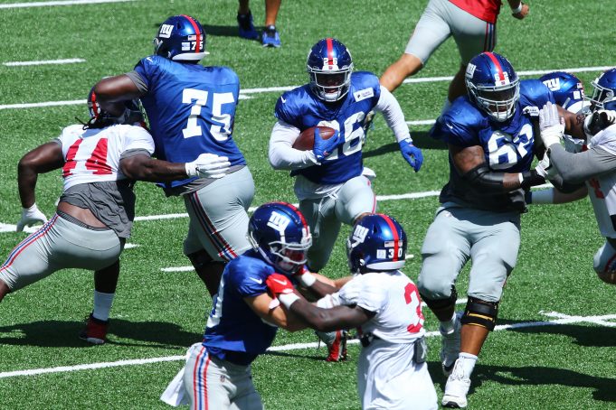 EAST RUTHERFORD, NEW JERSEY - SEPTEMBER 03: Saquon Barkley #26 of the New York Giants runs the ball during the Blue and White scrimmage at MetLife Stadium on September 03, 2020 in East Rutherford, New Jersey.