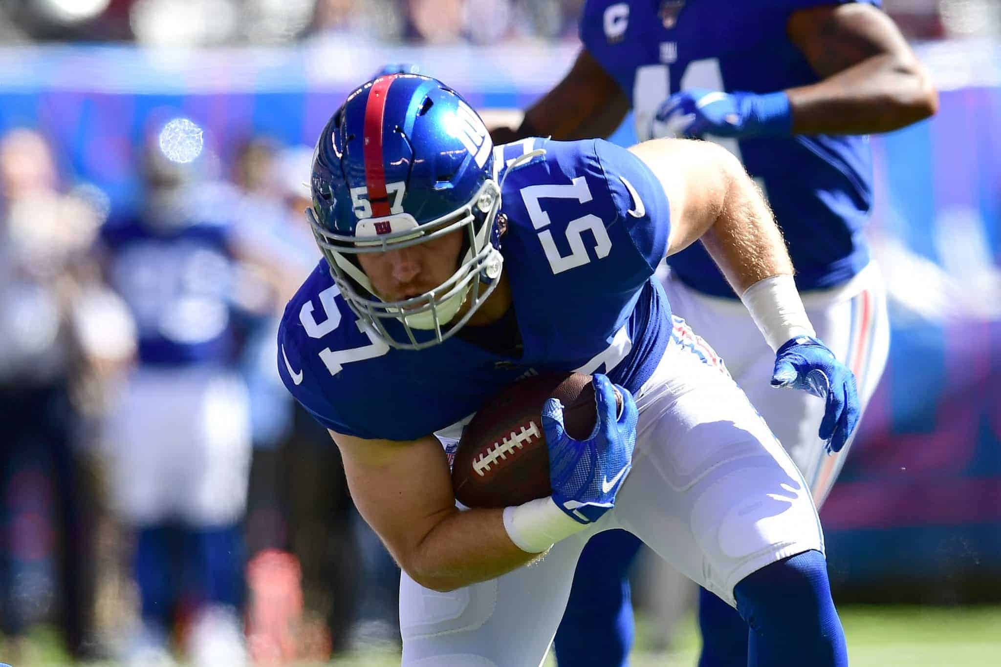 EAST RUTHERFORD, NEW JERSEY - SEPTEMBER 29: Ryan Connelly #57 of the New York Giants carries the ball during their game against the Washington Redskins at MetLife Stadium on September 29, 2019 in East Rutherford, New Jersey.