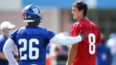 EAST RUTHERFORD, NEW JERSEY - AUGUST 23: Saquon Barkley #26 and Daniel Jones #8 of the New York Giants talk at NY Giants Quest Diagnostics Training Center on August 23, 2020 in East Rutherford, New Jersey.