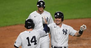 NEW YORK, NEW YORK - SEPTEMBER 15: Luke Voit #59 of the New York Yankees celebrates with Tyler Wade #14 after hitting a three-run home run during the second inning against the Toronto Blue Jays at Yankee Stadium on September 15, 2020 in the Bronx borough of New York City.