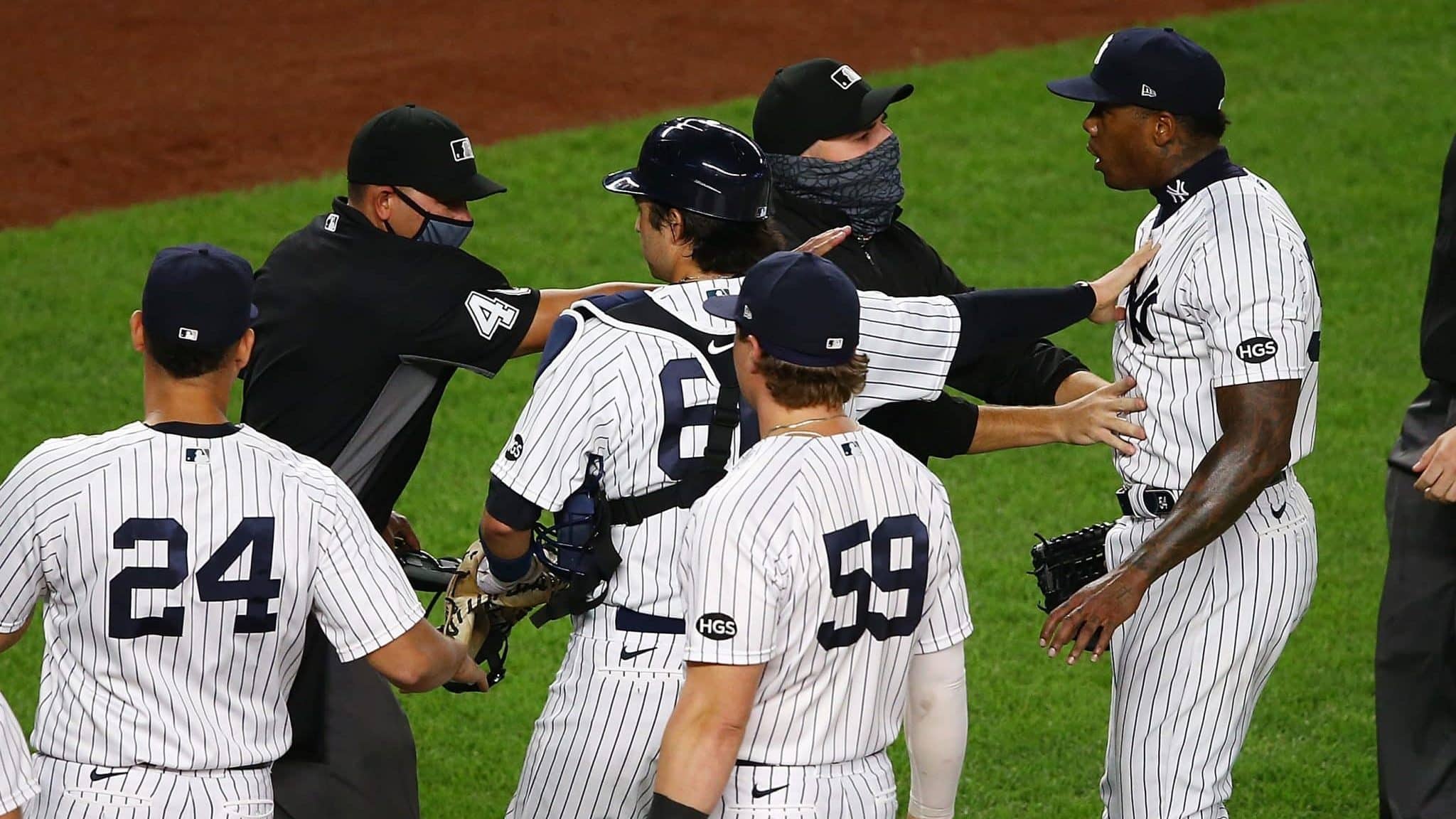 NEW YORK, NEW YORK - SEPTEMBER 01: Aroldis Chapman #54 of the New York Yankees exchanges words with the Tampa Bay Rays after the final out in the ninth inning at Yankee Stadium on September 01, 2020 in New York City.